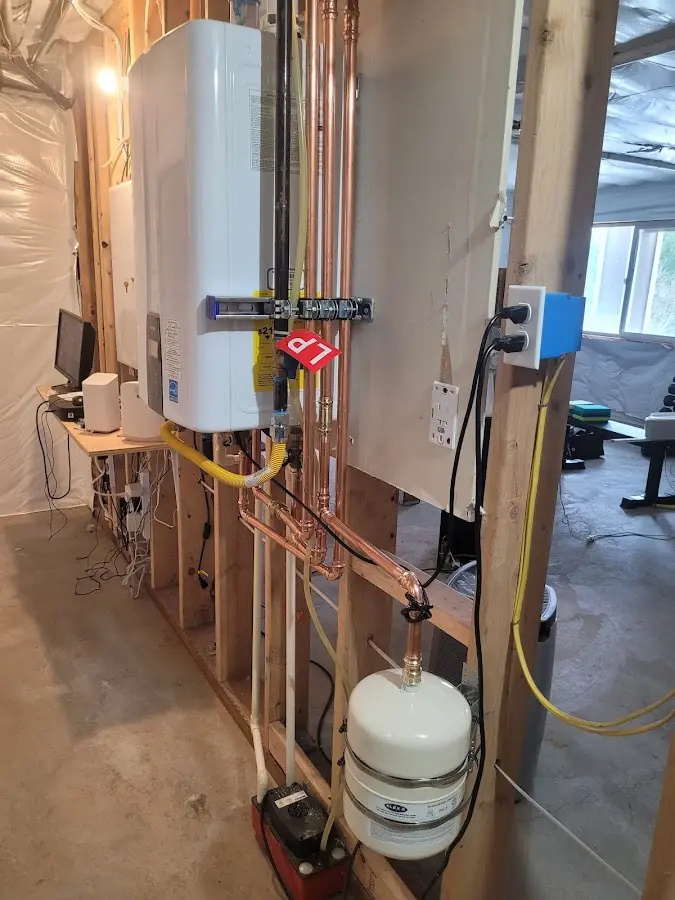 Licensed plumber repairing a kitchen sink in East Troy