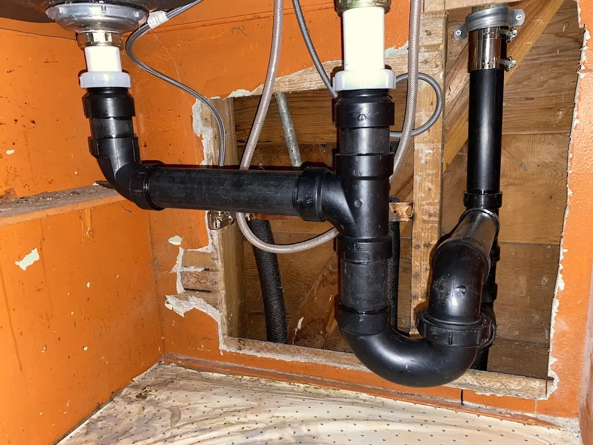 Professional Garbage Disposal Repair equipment and tools on the job in East Troy